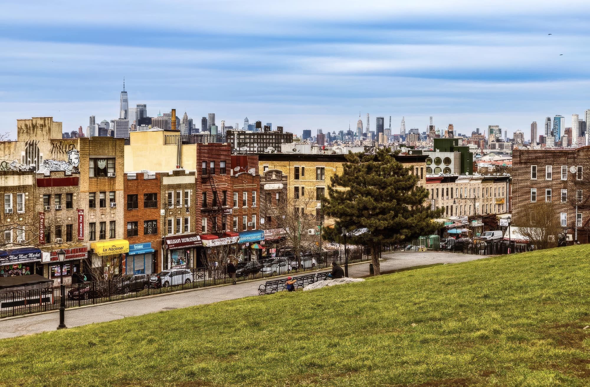 Brooklyn neighborhood street with the Manhattan skyline in the distance