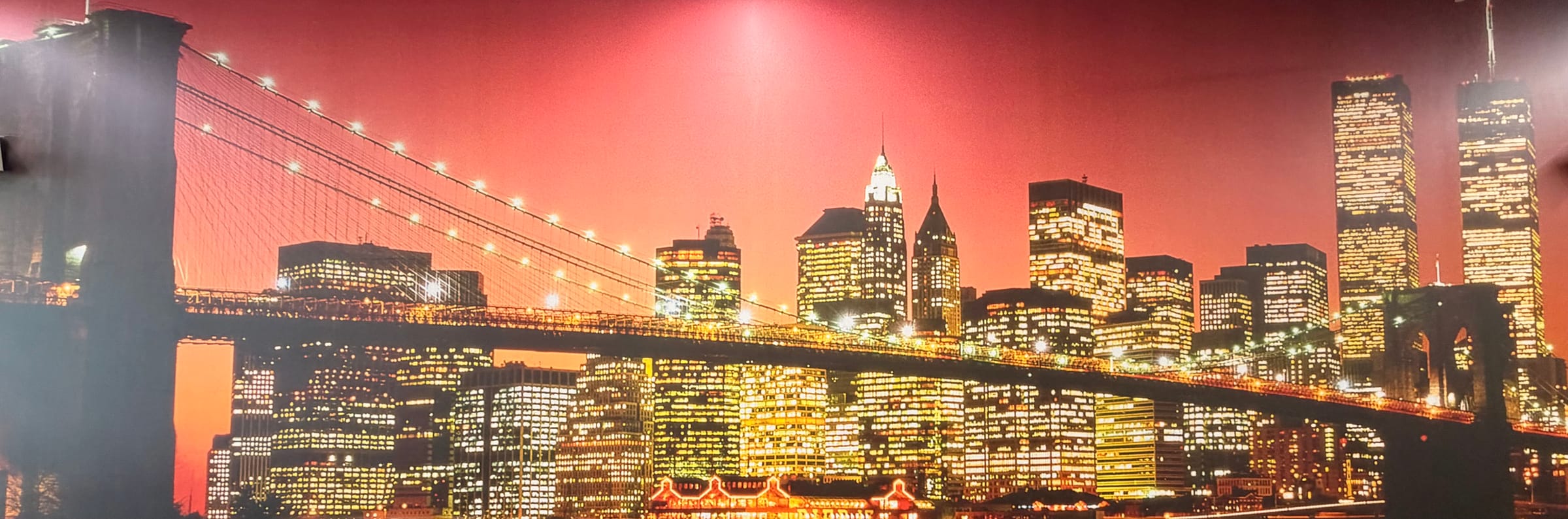 Brooklyn Bridge and the New York City skyline lit up at night
